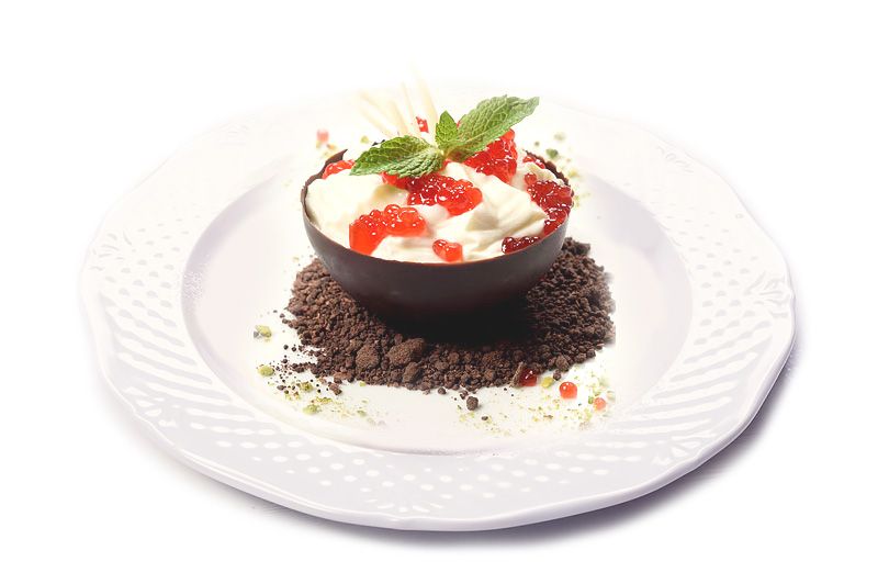 Cottage cheese mousse in dark chocolate hemisphere